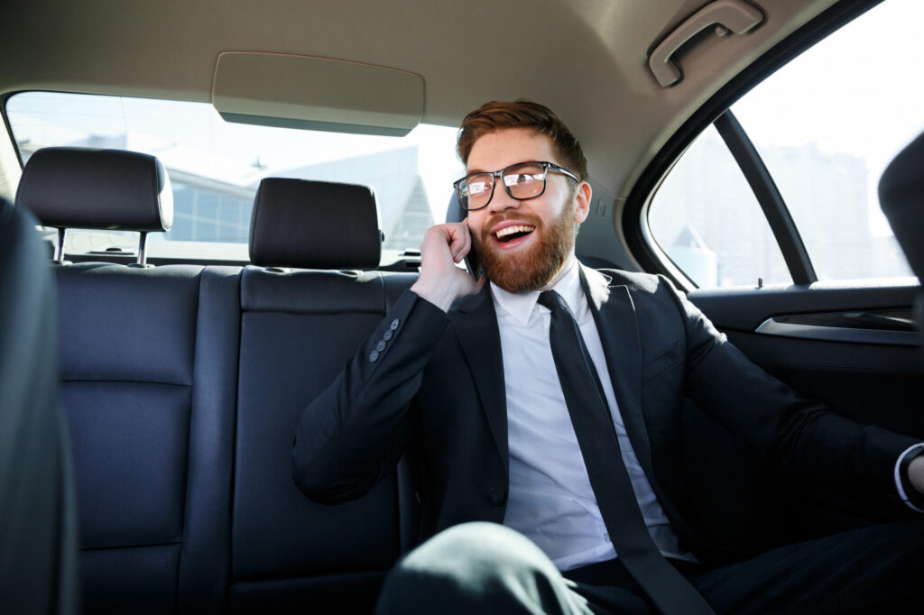 smiling-bearded-business-man-eyeglasses-talking-cell-phone